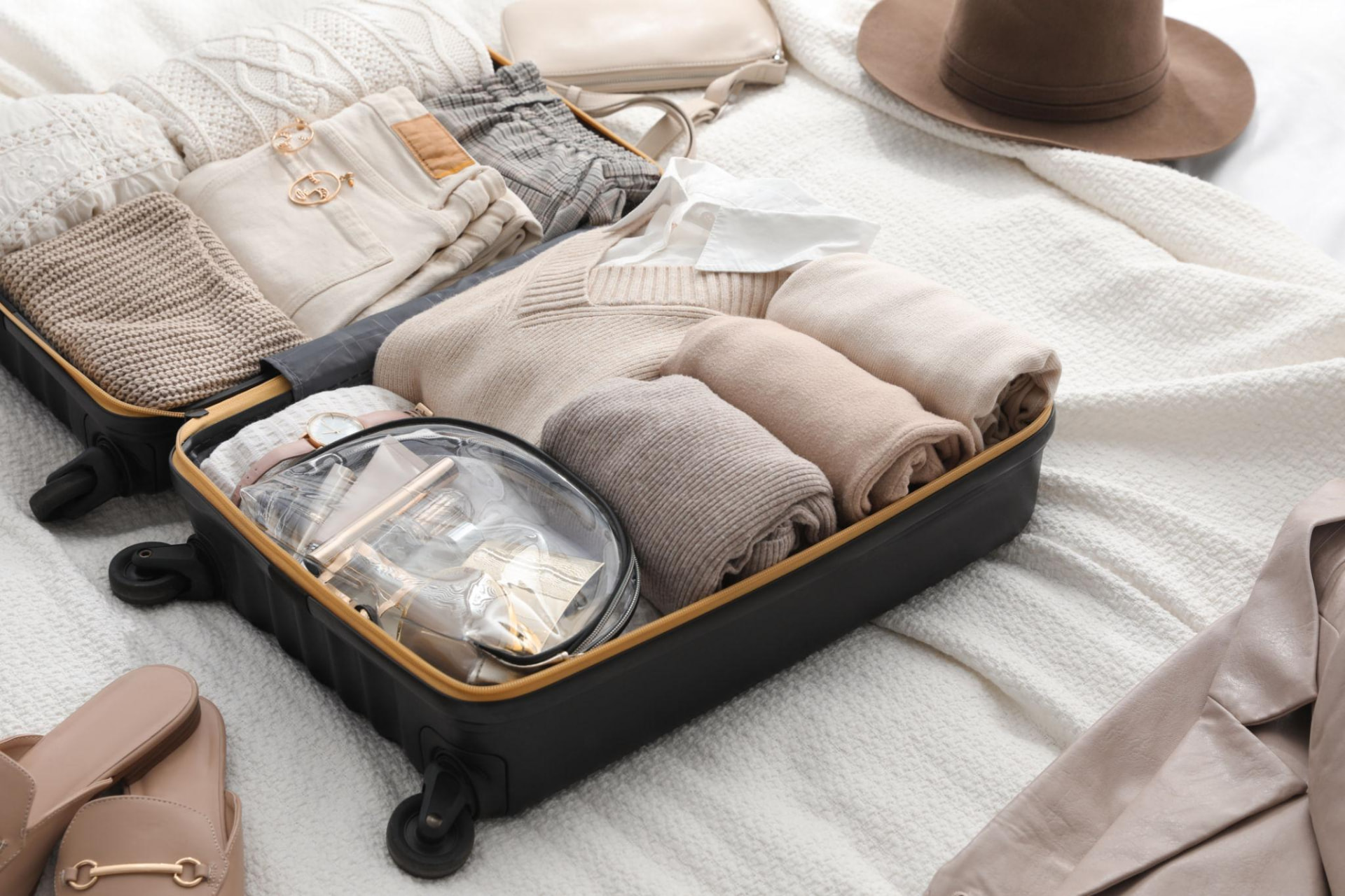 Clothing folded and organized in a suitcase